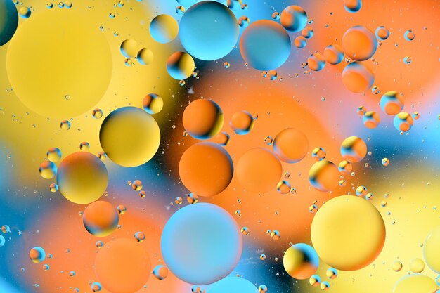 Фото Синие и оранжевые пятна с многоцветными кругами, похожими на галактику и микрокосмос 4
