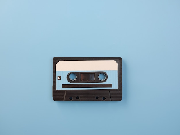 Blue audio cassette on blue wall