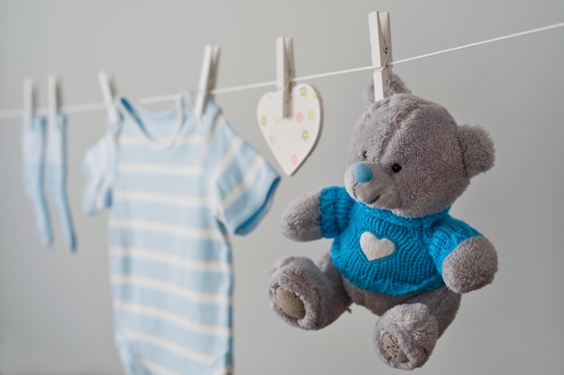 Photo blue baby clothes on the clothesline