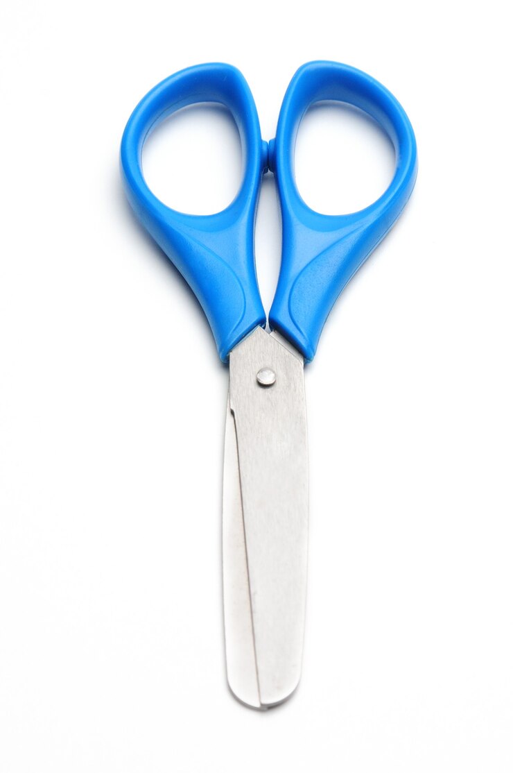 Blue baby scissors on an isolated white