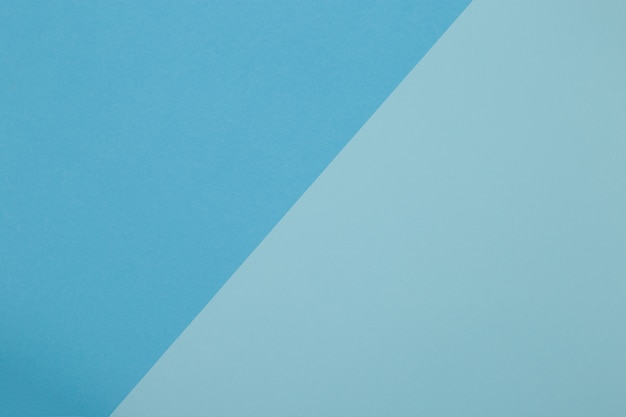 Blue background, colored paper geometrically divides into zones