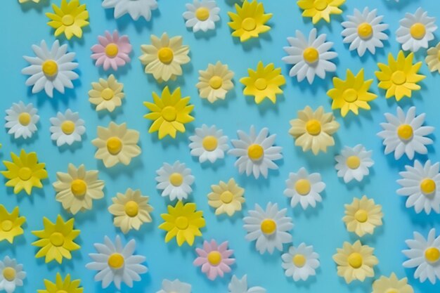 A blue background with flowers and a yellow one.