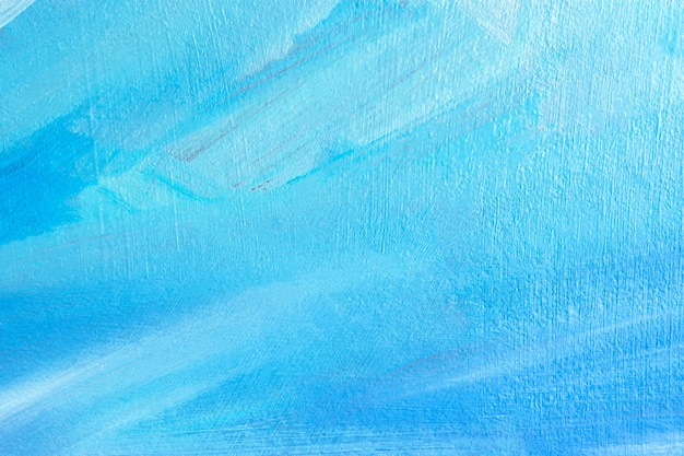 Blue background with oil paint. Beautiful close - up brushstrokes. Textured abstract background. Oil painting on cardboard and canvas. Winter and Christmas concept. Layout for greetings.