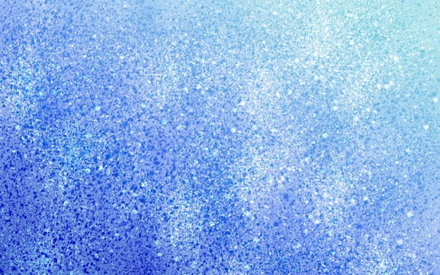 A blue background with a pattern of glitter.