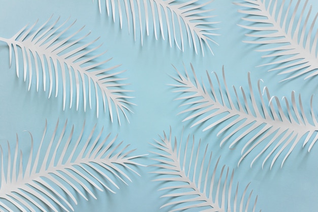 Blue background with spiky white paper feathers