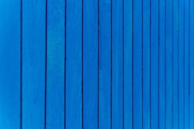 Photo blue background with vertical lines metal fence