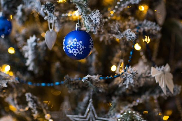 blue ball hanging on the tree