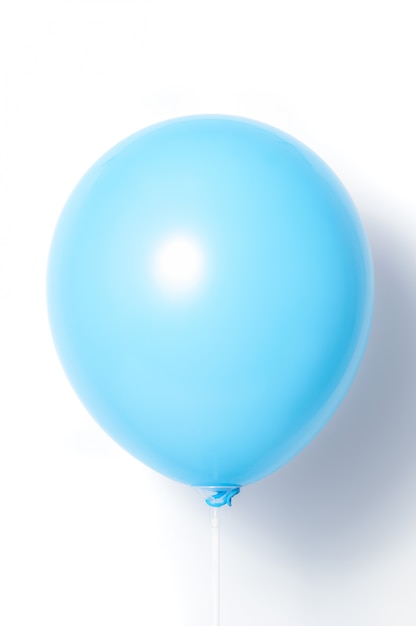 Blue balloon on white background with shadow. Side glare.