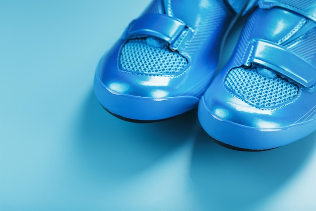 Blue bicycle shoes on a blue background