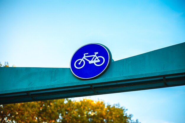 Blue bike path sign in the park bike path with of bicycle symbol
