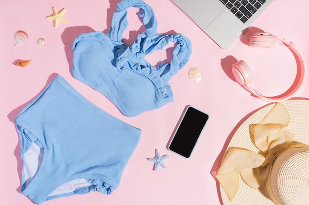 Blue bikini set on pink summer background