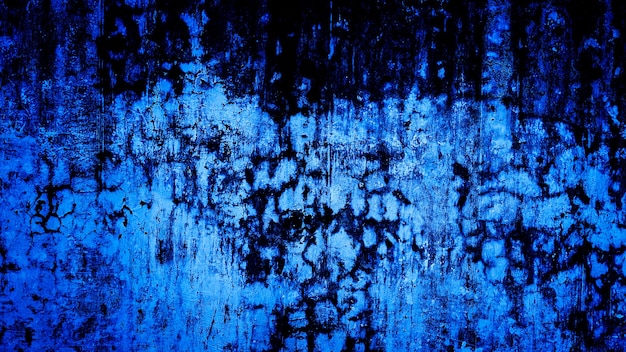 苦しめられた壁のコンクリートの青黒のテクスチャ背景