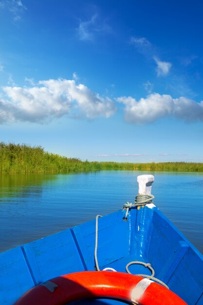 Blue boat sailing in Albufera lake of Valencia