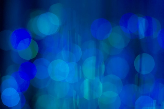 Blue bokeh background with emerald and white tint