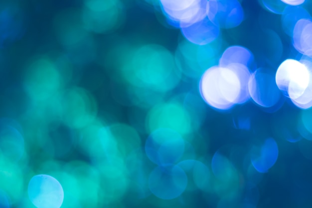 Blue bokeh. Blurred light on blue background.