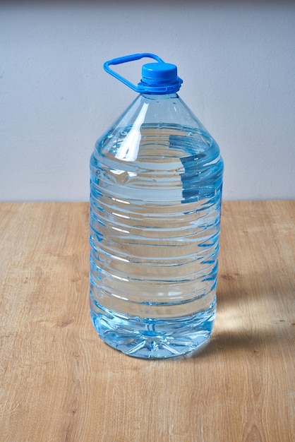 A blue bottle of water with a blue cap.