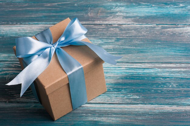 Blue bow on handmade present box