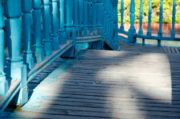 Blue bridge in formal garden