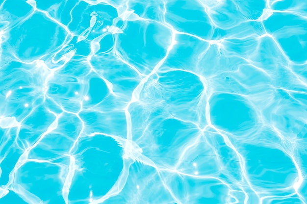 Blue and bright ripple water and surface in swimming pool