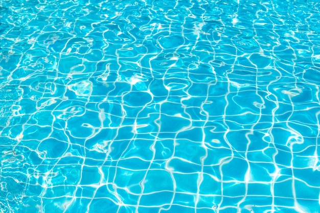 Blue and bright ripple water and surface in swimming pool