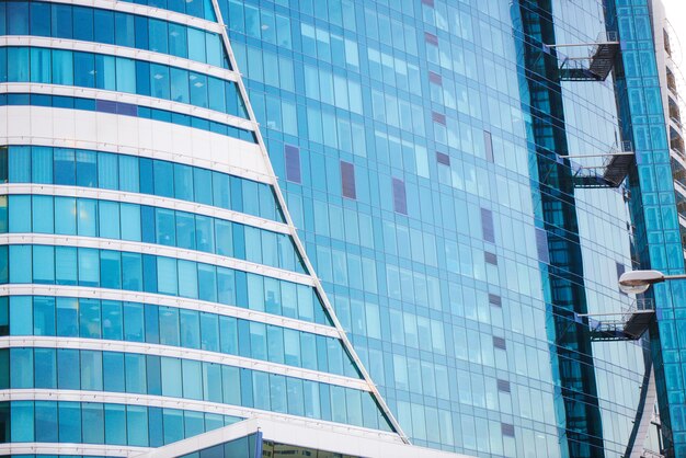 Blue business background the glass facade of the building