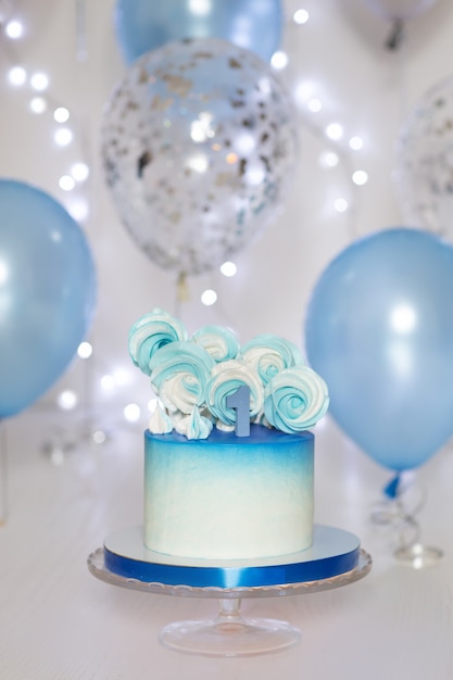 blue cake and balloons