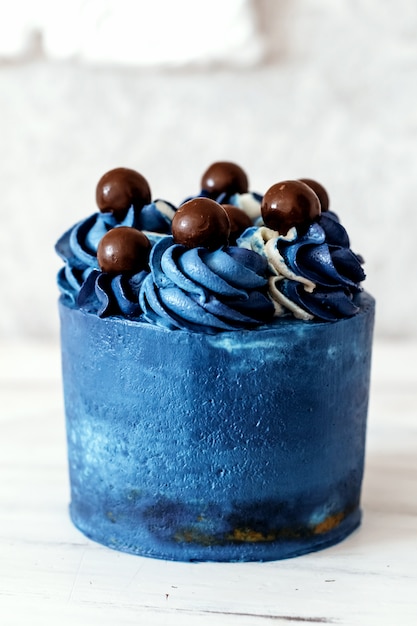 Blue cake, modern dessert, simple decoration.