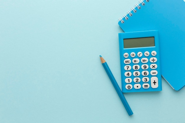 Blue calculator on a colored background