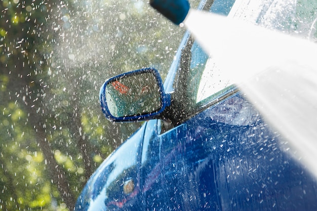 Blue car in a car wash