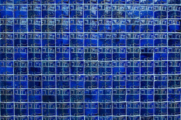 Photo the blue ceramic tiles on the wall  for interior or exterior design