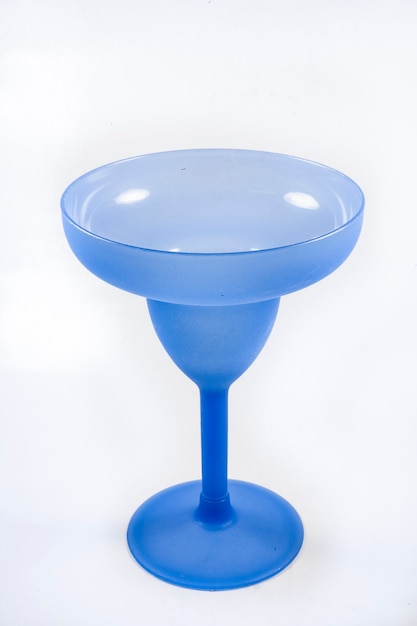 Blue champagne glass on white background.