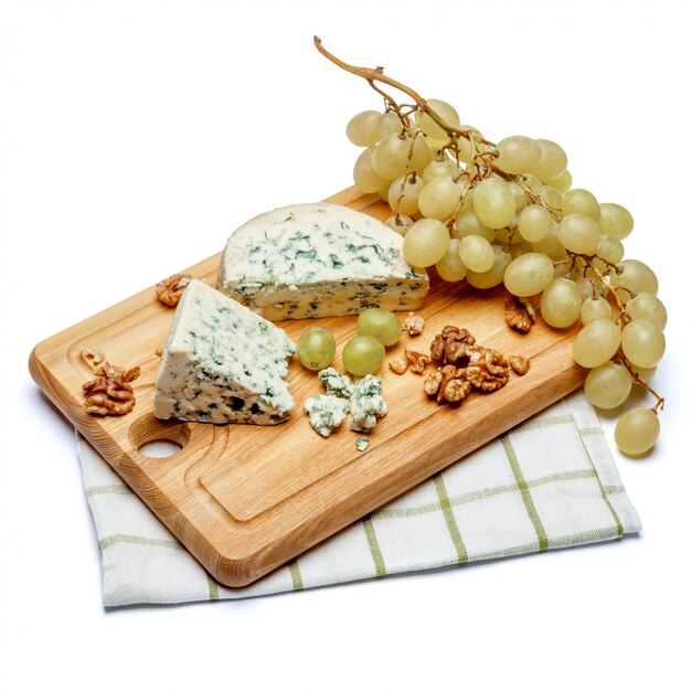 Blue cheese on wooden cutting board