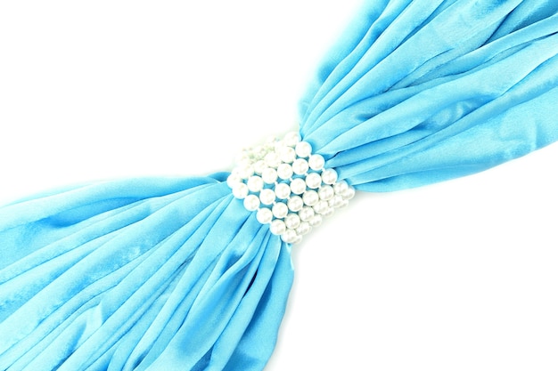 Blue cloth tied with pearls isolated on white