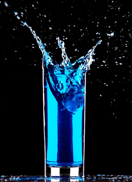 Blue cocktail splashing 