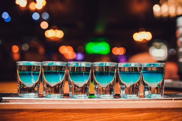 Blue cocktails in the club