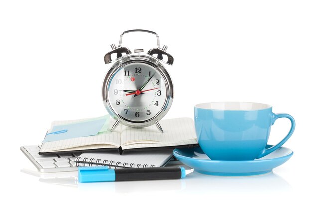 Blue coffee cup alarm clock and office supplies