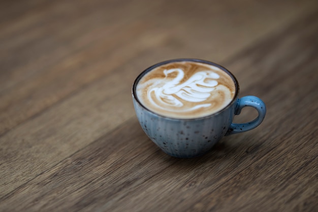 Blue coffee mug on the wooden table