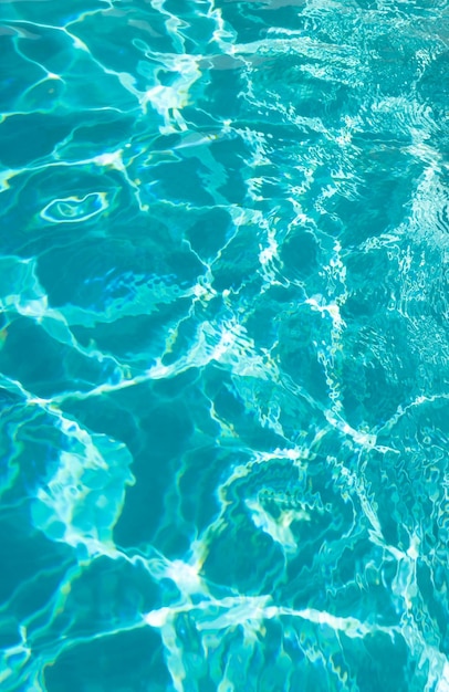 Blue color background of swimming pool water with ripples in mediterranean