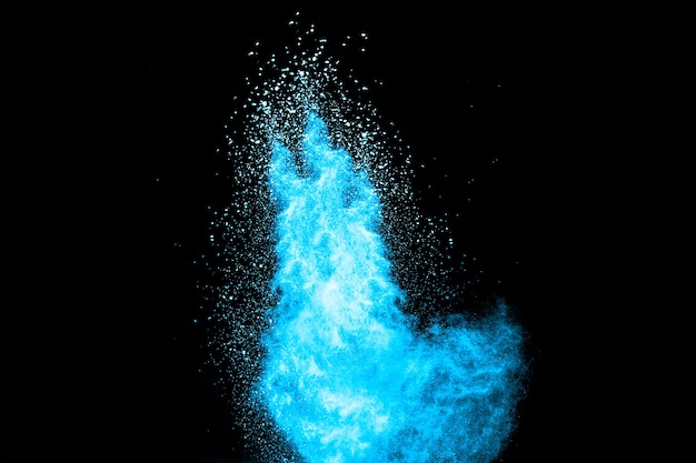 Blue color powder explosion on black background.