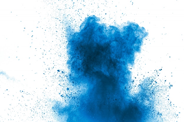 Blue color powder explosion cloud. Closeup of Blue dust particles splash on background.