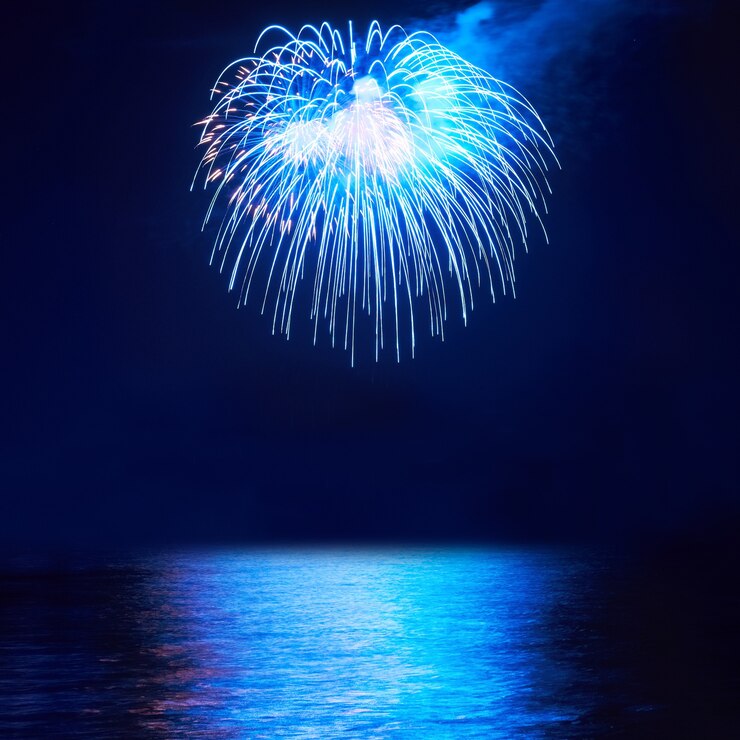 Blue colorful fireworks on the black sky background