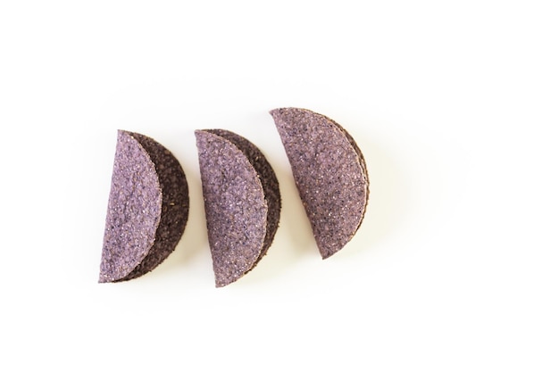 Blue corn taco shells on a white background.