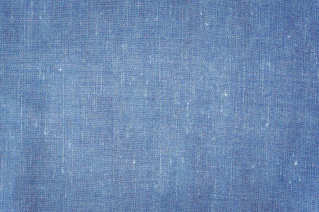 Синий хлопковый льняной фон, концепция текстильной ткани