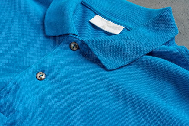 Blue cotton polo t-shirt texture close up. Men's fashion