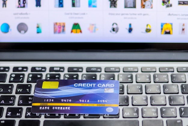 Blue credit card on a computer keyboard