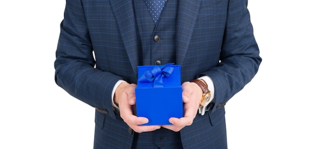 Blue cube cardboard box pack tied with elegant ribbon being held in male hands for holiday celebration isolated on white, gift.