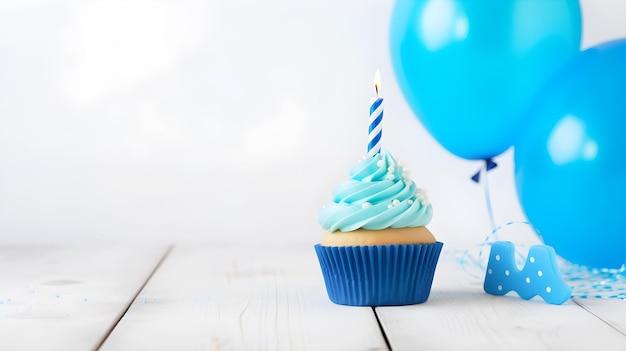 Photo a blue cupcake with a blue candle next to it