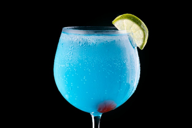 Blue Curacao cocktail with lemon and cherry