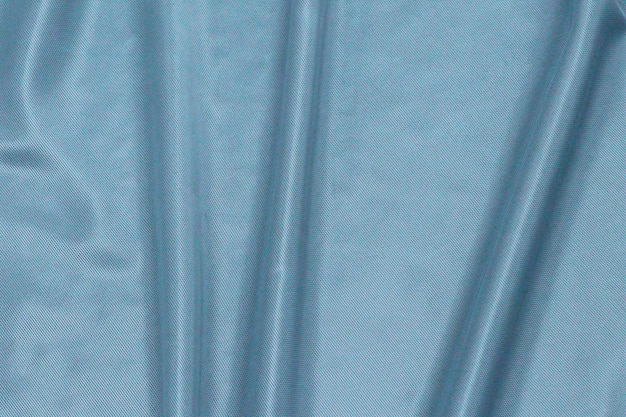 A blue curtain with a pattern of lines in the middle