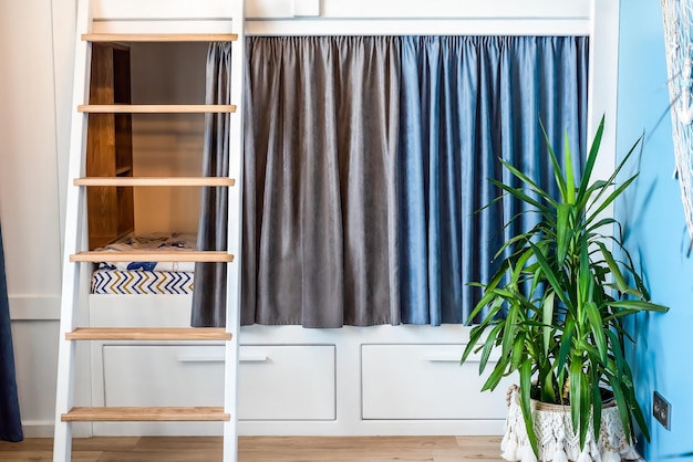 Blue curtains for bunk bed for boys in the bedroom without people